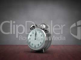 Composite image of alarm clock counting down to twelve