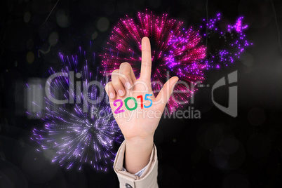 Composite image of businesswoman pointing