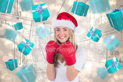 Composite image of festive blonde punching with boxing gloves