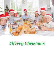 Composite image of smiling family around the dinner table at chr