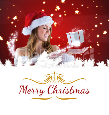 Composite image of sexy santa girl presenting with hand