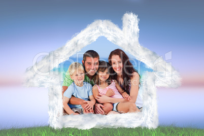 Composite image of portrait of a family at the beach