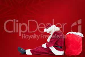 Composite image of santa sits leaned on his bag