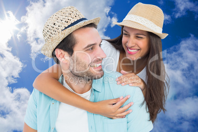 Composite image of happy casual man giving pretty girlfriend pig