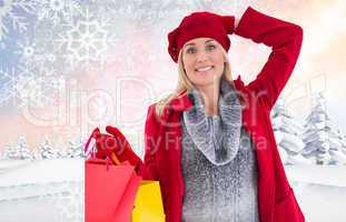 Composite image of blonde in winter clothes holding shopping bag