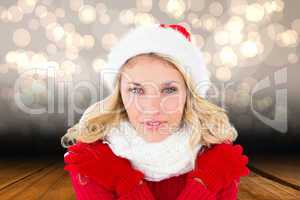 Composite image of happy festive blonde