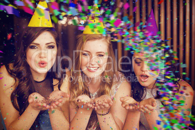 Composite image of attractive friends celebrating a birthday