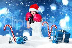 Composite image of woman wearing red boxing gloves