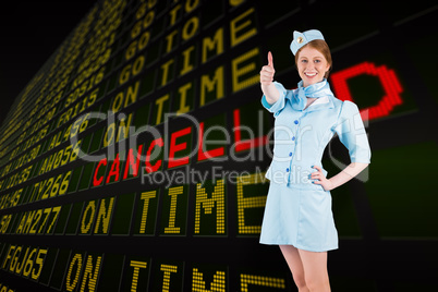 Composite image of pretty air hostess with hand on hip