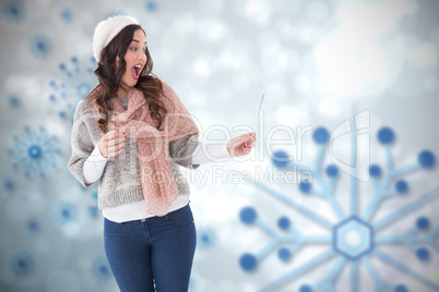 Composite image of surprised brunette in winter clothes