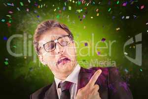 Composite image of young geeky businessman pointing to shoulder