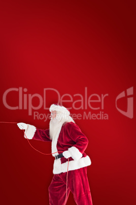 Composite image of santa pulls something with a rope