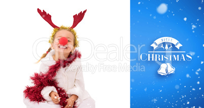 Composite image of cute little girl wearing red nose and tinsel