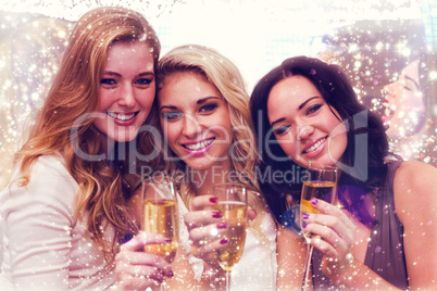 Composite image of pretty friends drinking champagne together