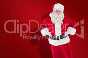 Composite image of cheerful santa claus with his hands on hips