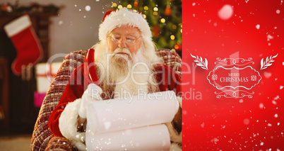 Composite image of santa claus writing his list with a quill