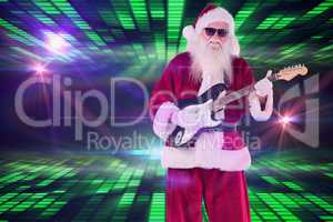 Composite image of santa claus plays guitar with sunglasses