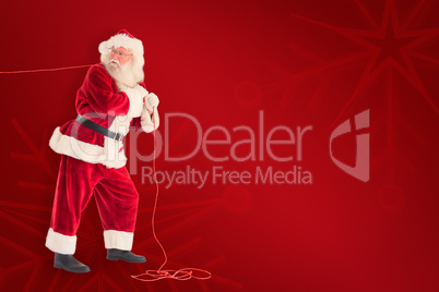 Composite image of santa pushes a shopping cart