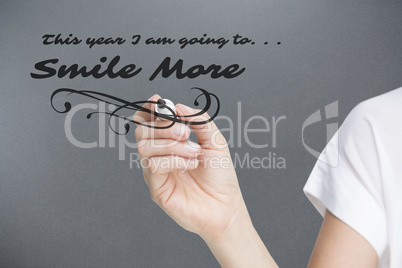 Composite image of female hand holding black whiteboard marker