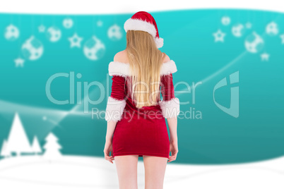 Composite image of festive blonde standing rear view