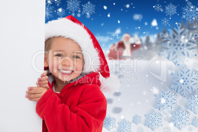 Composite image of festive little girl showing poster