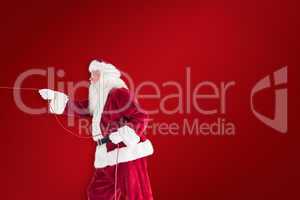Composite image of santa pulls something with a rope