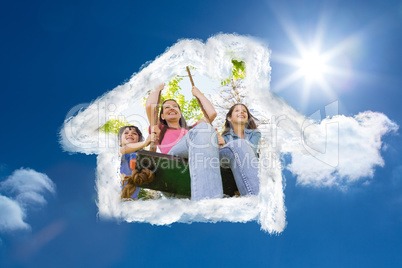 Composite image of kids pushing mother on swing