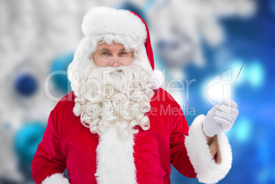 Composite image of portrait of perplexed santa holding