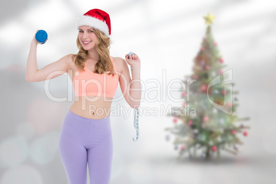 Composite image of smiling fit blonde holding dumbbell and measu