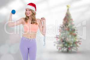 Composite image of smiling fit blonde holding dumbbell and measu