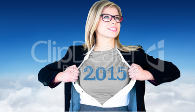 Composite image of businesswoman opening shirt in superhero styl