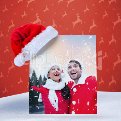 Composite image of festive young couple