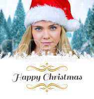 Composite image of blonde with bare shoulders in santa hat