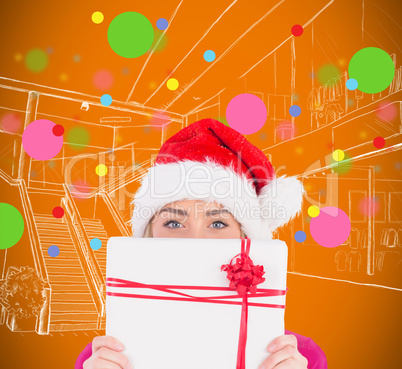 Composite image of festive blonde holding christmas gift