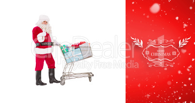 Composite image of positive santa delivering gifts with a trolle