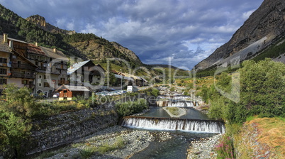 River fall at Cervieres village, Alps mountains, France