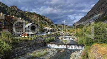 River fall at Cervieres village, Alps mountains, France