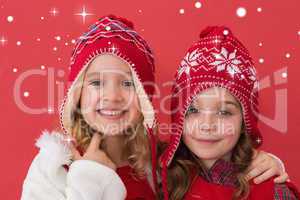 Composite image of festive little girls smiling at camera