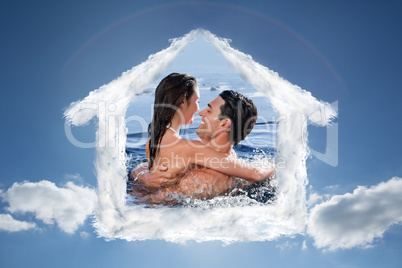 Composite image of joyful couple cuddling each other