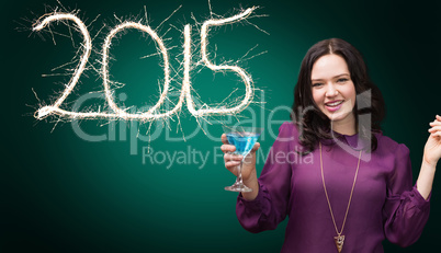 Composite image of brunette drinking cocktail