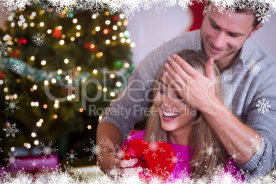 Composite image of loving boyfriend surprising his girlfriend