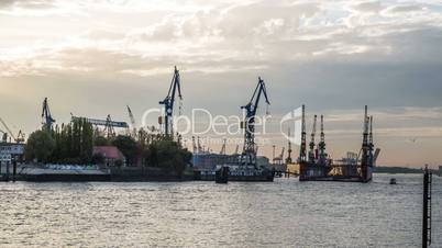 Hamburg Harbor, Bloom & Foss Dock - Crane and a cloudy sky, sunset - DSLR timelapse