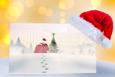 Composite image of santa delivery presents to village