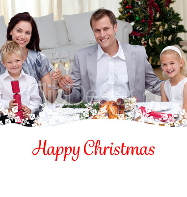 Composite image of parents toasting with wine in christmas dinne