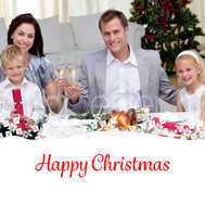Composite image of parents toasting with wine in christmas dinne