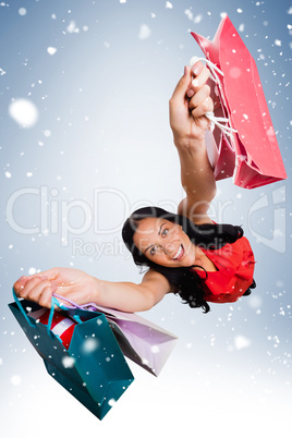 Woman standing with shopping bags