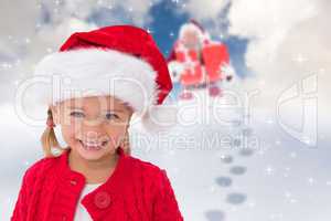 Composite image of cute little girl wearing santa hat