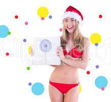 Composite image of festive fit blonde in red bikini showing scal