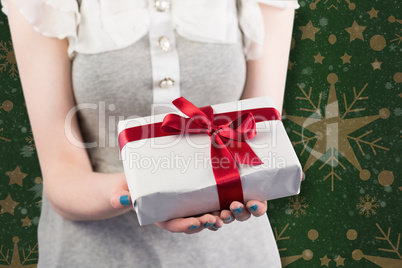 Composite image of woman offering a wrapped gift