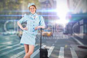 Composite image of pretty air hostess smiling at camera
